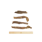 four dried beef jerky pieces on a white background.