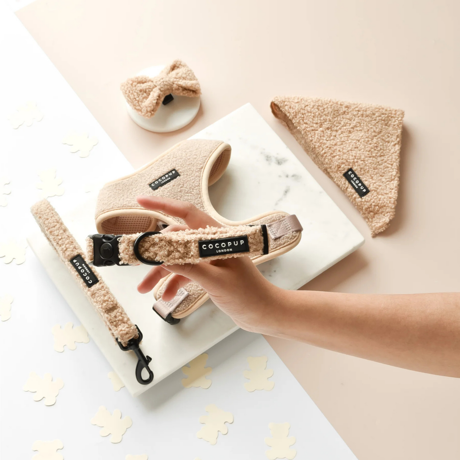 Cocopup pet products including a harness, leash, and headband on a light background.