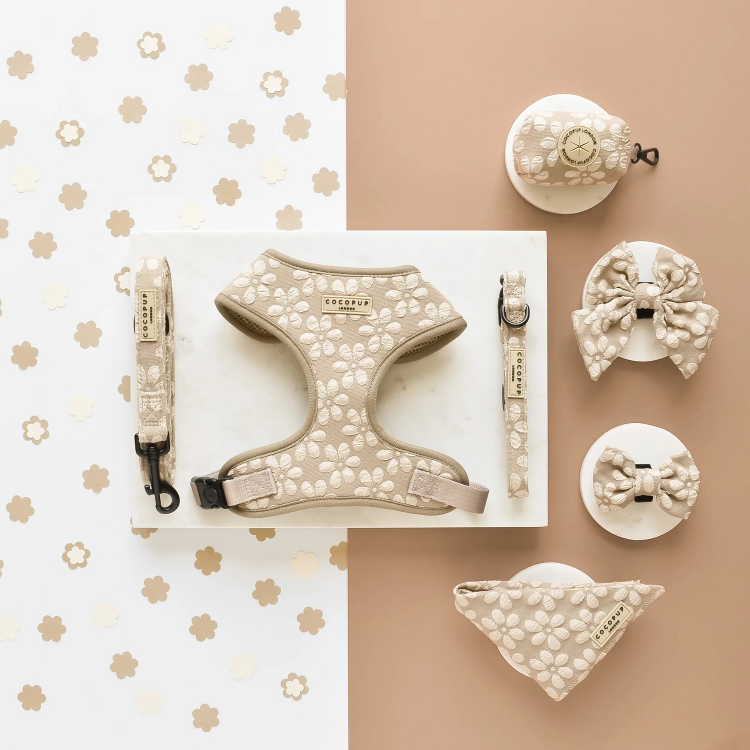 Dog harness, leash, and accessories with floral patterns on a beige and white background