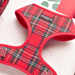 Red plaid dog harness with 'CocoPup London' label on a light background
