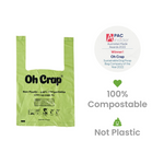 Green compostable dog waste bag with branding and certification details on a white background