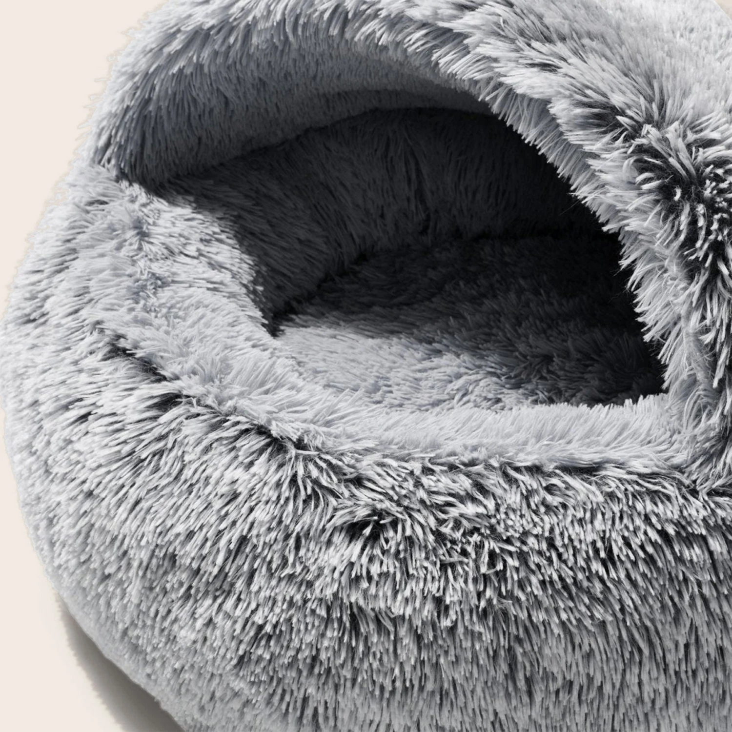 Close-up of a gray plush pet bed with a soft texture.