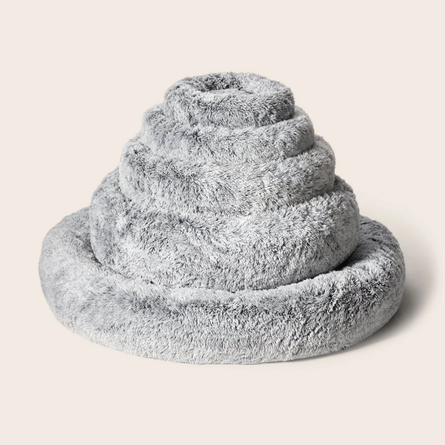 Stack of gray textured dog beds showing size on a light beige background