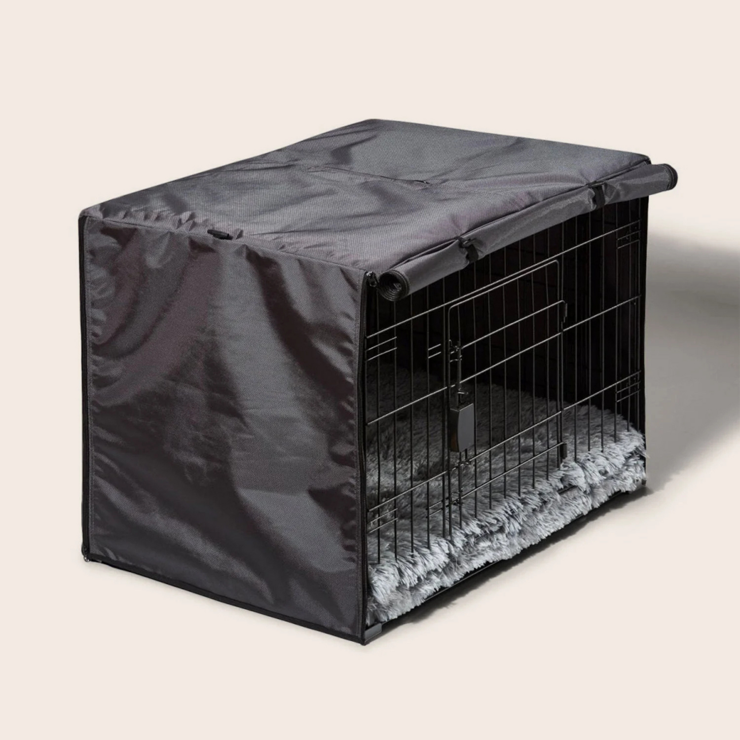 Dog crate with a black cover on a light gray background
